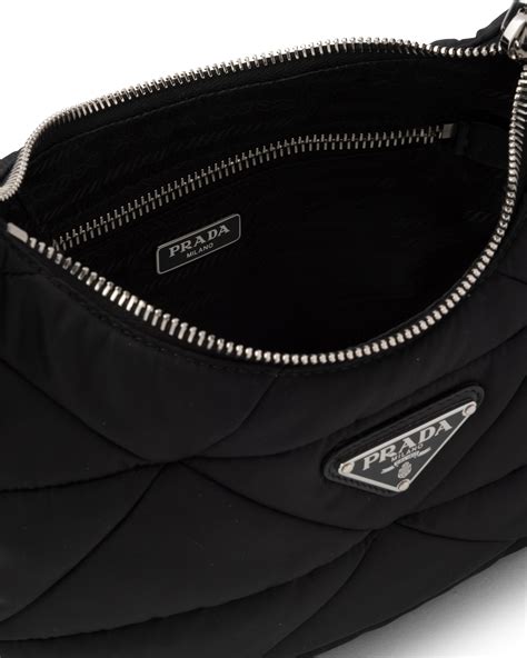 prada leather handbag with large woven motif|Prada padded nylon shoulder bag.